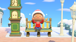 My Animal Crossing: New Horizons player sitting on a bench and crying